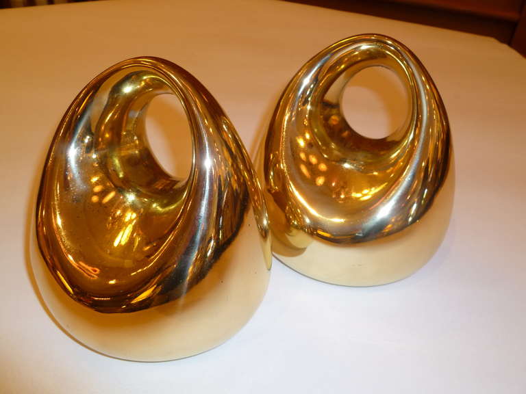 From the late 1940s and 1950s,  brass Stirrup form bookends by Ben Seibel for Jenfred-Ware.

 Each measures 5 1/2