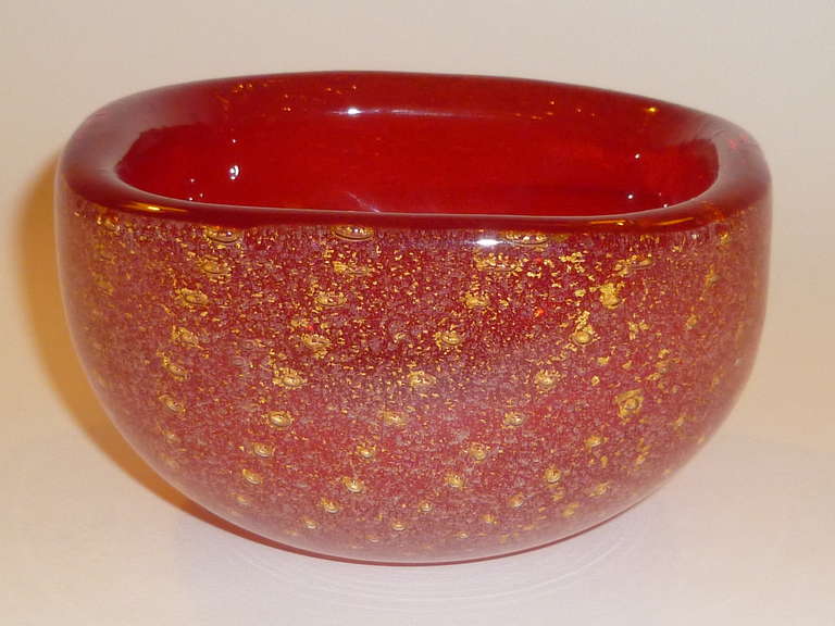 Stunning jewel of a bowl in ruby red with gold leaf flecks and controlled gold bubbles.  Attributed to Ercole Barovier for Barovier & Toso, Murano, circa 1950s.  Quite similar to work done by Carlo Scarpa for Venini as well.

Measurements:  5 1/4