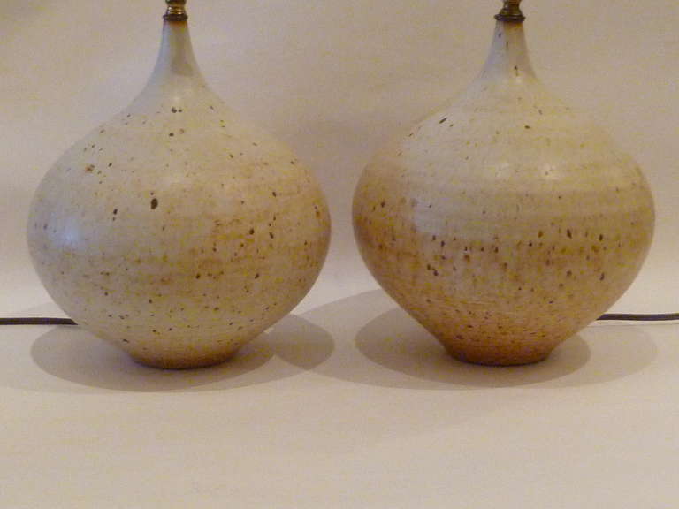 ....SOLD...Signed Schiffer, this pair of hand-thrown pottery lamps in a tear-drop or onion shape have a great organic persona.  The speckled egg look glaze and the shape and form exude great craftsmanship.  Both rewired and with new antique brass UL