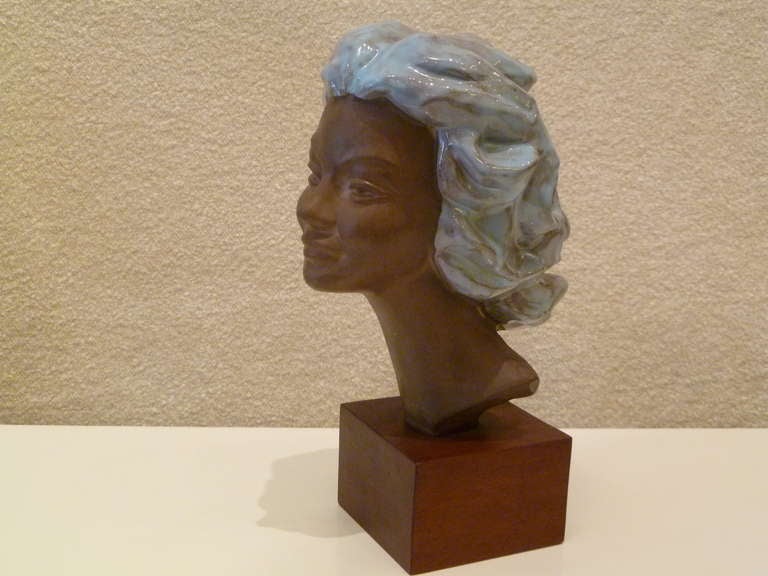 By noted Belgian sculptor Paul Serste´ (1910-2000) is quite beautiful with flowing blue glazed hair. A terre cotta bust of a woman mounted on a walnut base, it is signed in the clay.

For trade net price, purchasing & shipping, please contact