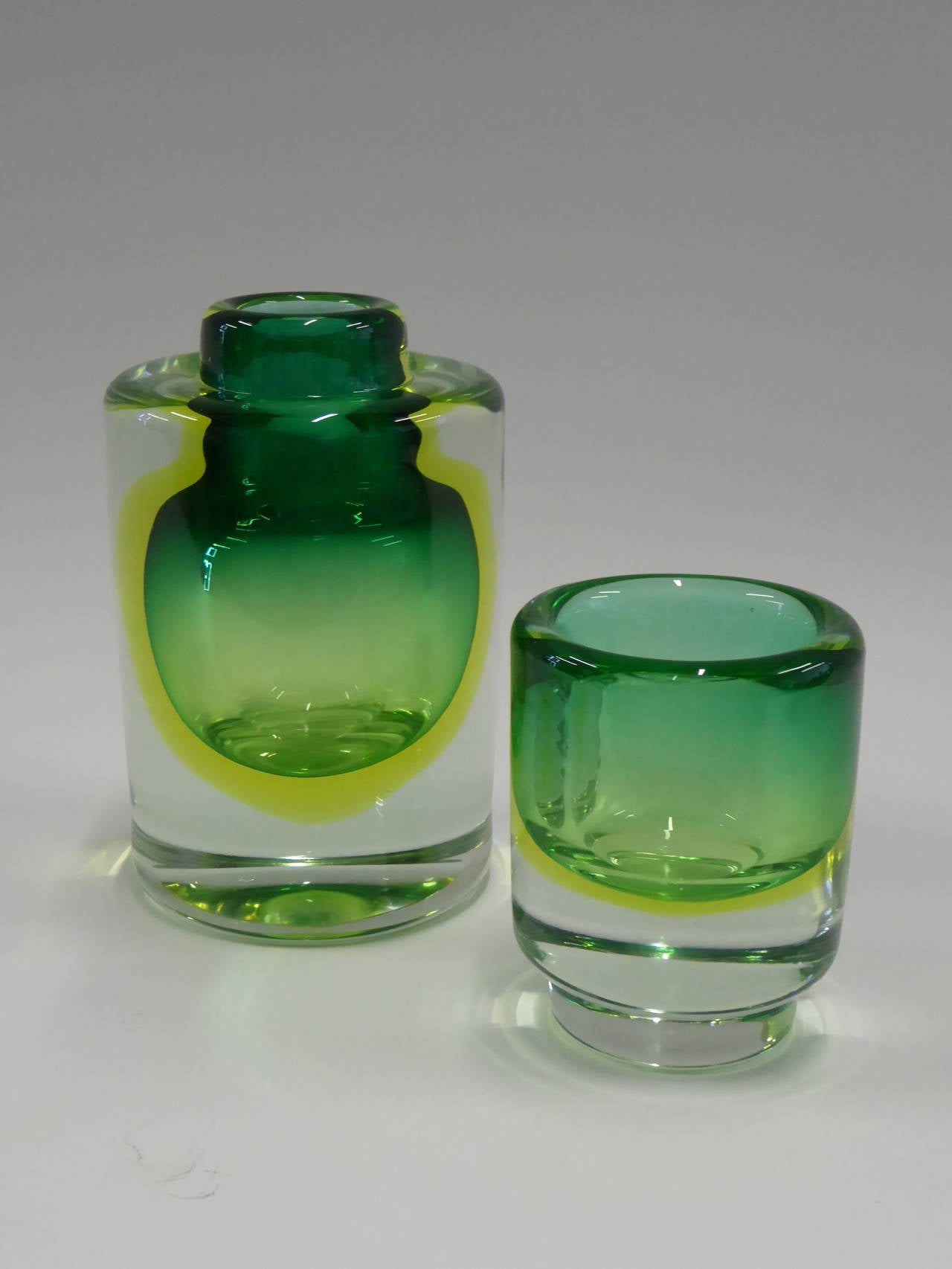 REDUCED FROM $750....Very thick walled, these Cenedese Sommerso vessels have a green casing and a uranium glass layer that adds a aura and glow to the pieces especially under black light. Flawless thick very heavy polished pieces. Nice Murano!

A