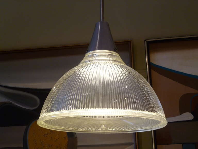Great Machine Age industrial styling ribbed glass pendant light from Holophane. Excellent all original with new wiring.   The light has a classic bowl shape glass shade , a smooth cone fixture canopy and a rigid 38