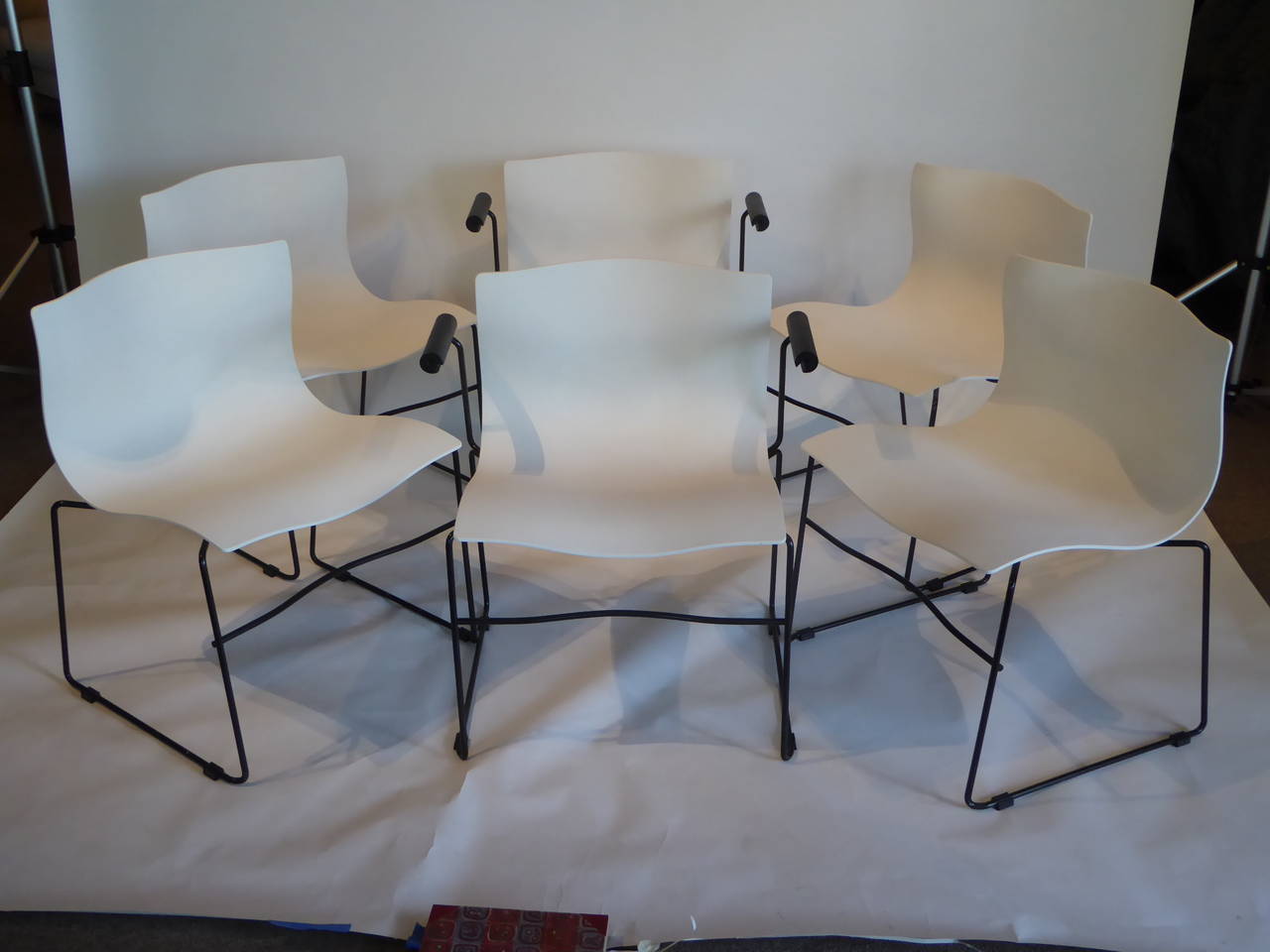SOLD  From Lella and Massimo Vignelli, the team behind Vignelli Designs, the handkerchief chair. Here six of the 1983 design in white for Knoll International, with two of the six having arms. Inspired by the lightness and organic ease of a