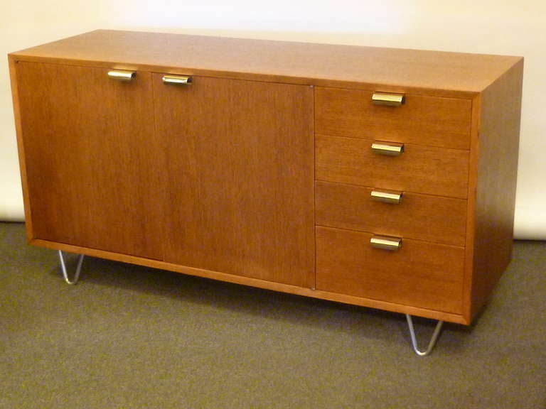 REDUCED FROM $4,750....With sought after nickel hair-pin legs and C curl pulls, this George Nelson cabinet has a rare low profile in that the height is 29 1/2