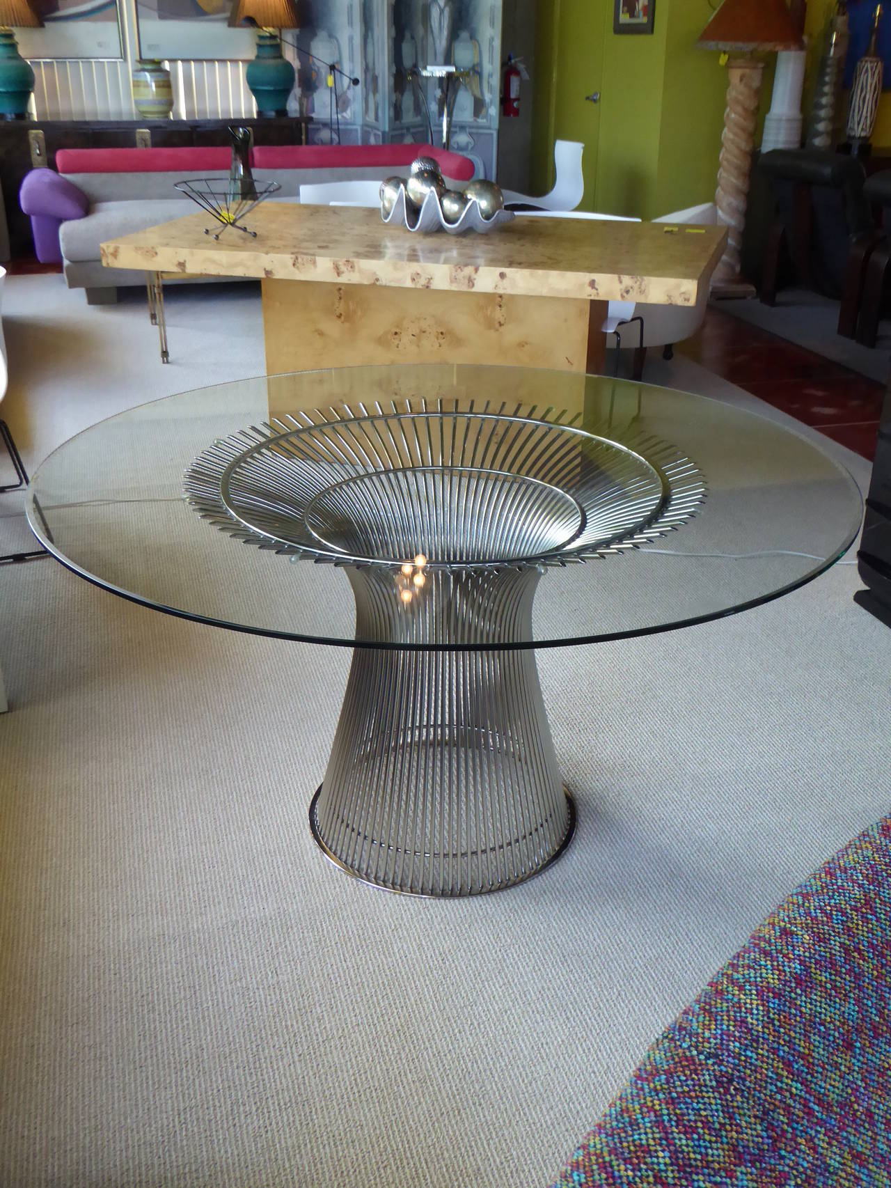 ...SOLD..1980s edition of Warren Platner's iconic modern dining table for Knoll International.  Up-sweeping base is nickel-plated vertical steel rods, holding a circular beveled glass.  Glass has a few scratches.

For trade pricing and shipping,