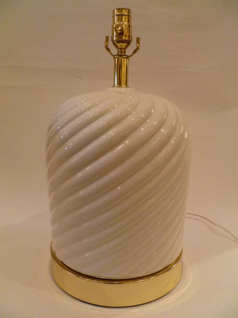 ....SOLD....Exhibiting his signature ceramic rope like swirl, this pair of fat white glazed ceramic table lamps are attributed to Tommaso Barbi.  With polished brass mounts, they are newly rewired and have new brass UL three way sockets.  They