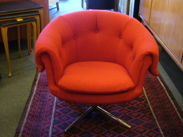 SOLD JUNE 2011 A rare and exciting lounge armchair from the Swedish designer Carl Eric Klote who founded Overman in the late 1950's, makers of iconic modern Scandinavian furniture.  With a plush button tufted draped back and egg chair style, it