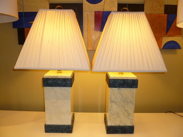 REDUCED FROM $1500....Stunning pair of lacquered faux marble finished table lamps from Maitland-Smith in an Art Deco style or perhaps post-modern. The square edge plinth forms lacquered with a marble finish with a carved wood base and collar edge in