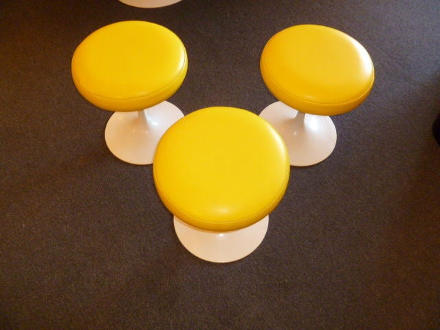 SOLD 9/11 From the Eero Saarinen Tulip Pedestal Collection designed in 1957, three early stools upholstered in their original yellow Naugahyde.  Sunny, bright, very smart, very classic and very movable and versatile!  All in very good original
