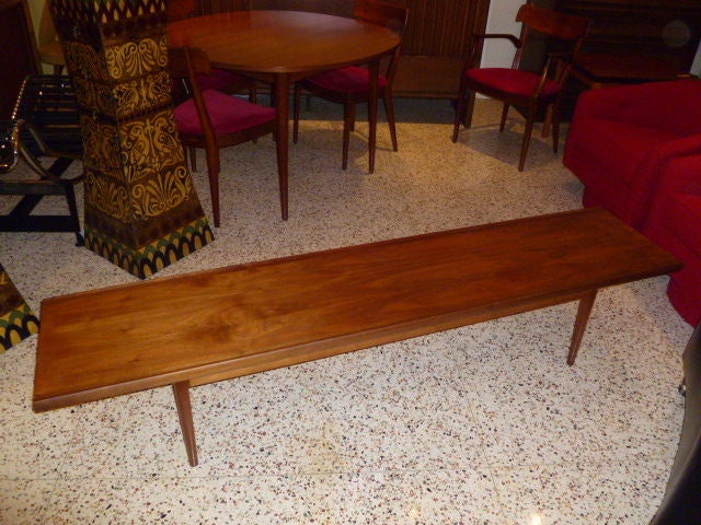 SOLD FEB 2012 Beautiful warm figured walnut highlights this lo-ong Drexel bench table as they have labeled it.  In a mid-century modern form, influenced by Danish modern.  Narrow tapered legs with a short apron support reflect the slim styling of