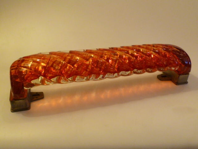 Magnificent door handle by Venini in Diamante glass rope form. Thick, heavy glass with striated blood red interior twist. In metal mounts with screw holes for mounting. In very good original condition with one small flake as pictured in closeup.   