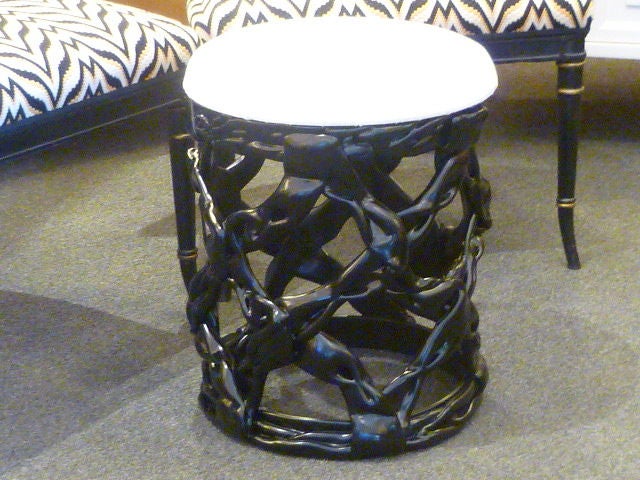 REDUCED FROM $1,250....Uniquely chic, this stool of black lacquered resin ribbons in the manner of Tony Duquette is a delight. In excellent condition having an attached vinyl upholstered cushion seat. Very nice!
15 inches in diameter  x  18 1/2