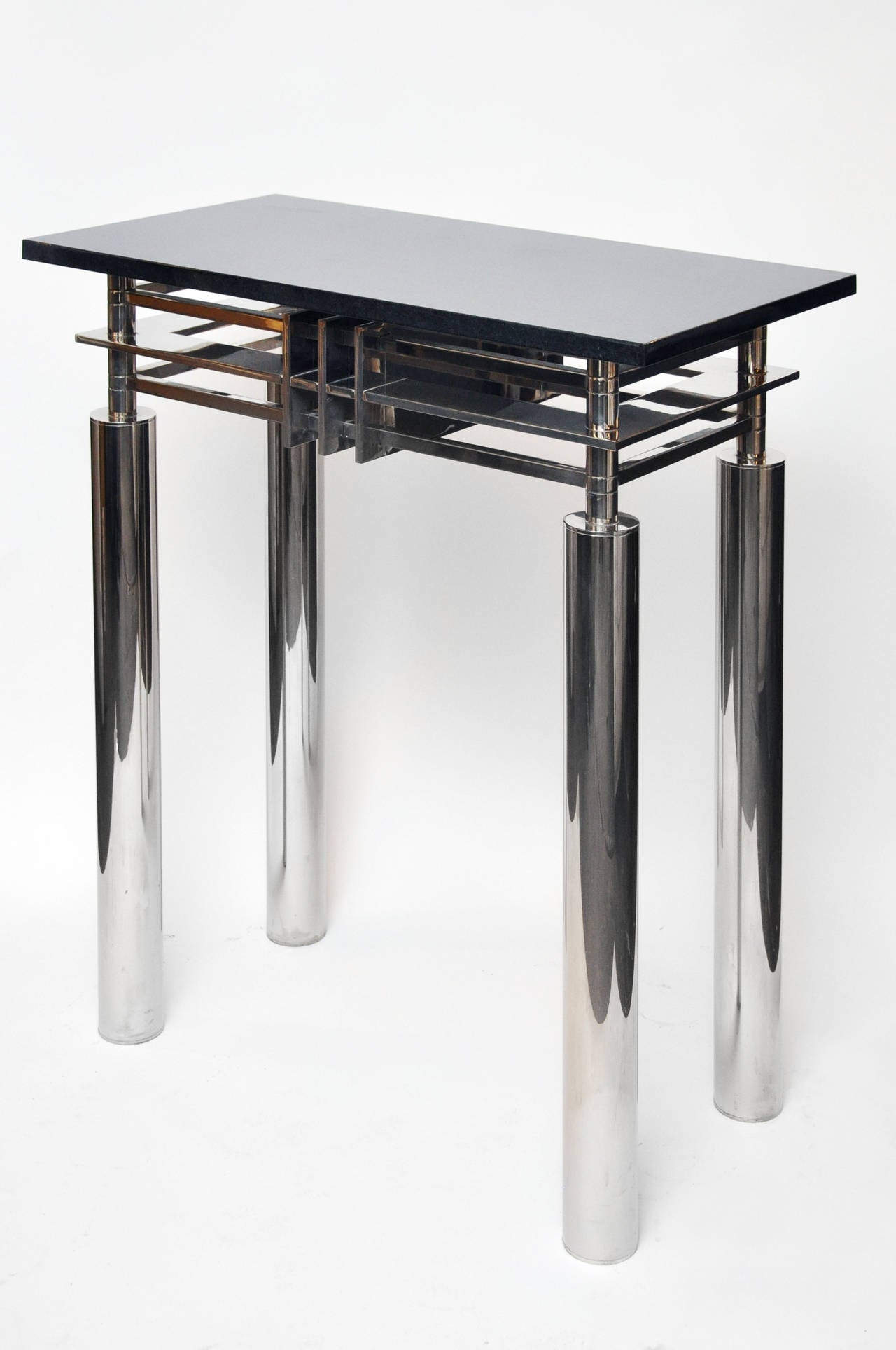 Beautiful high end chrome and marble tall console table. This is an extremely heavy piece. It has a sculptural quality. Marble top could be replaced with glass to show chrome lines and postmodern graphic design.