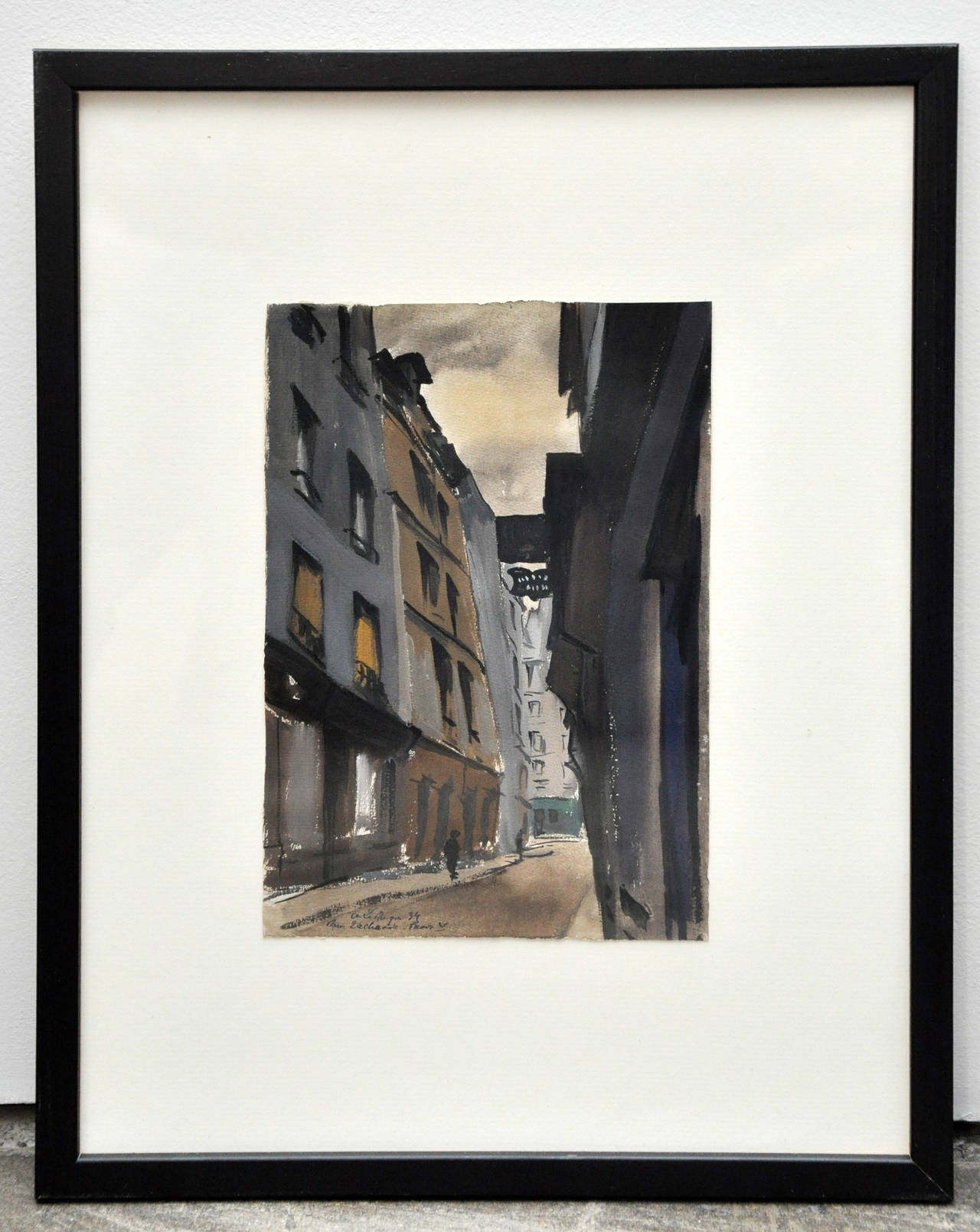 A series of original French watercolors, circa the 1950s of streets and buildings in Paris. Each painting has a label on the back of the frame with information regarding each street scene. Each painting is of a different street in Paris. Paintings