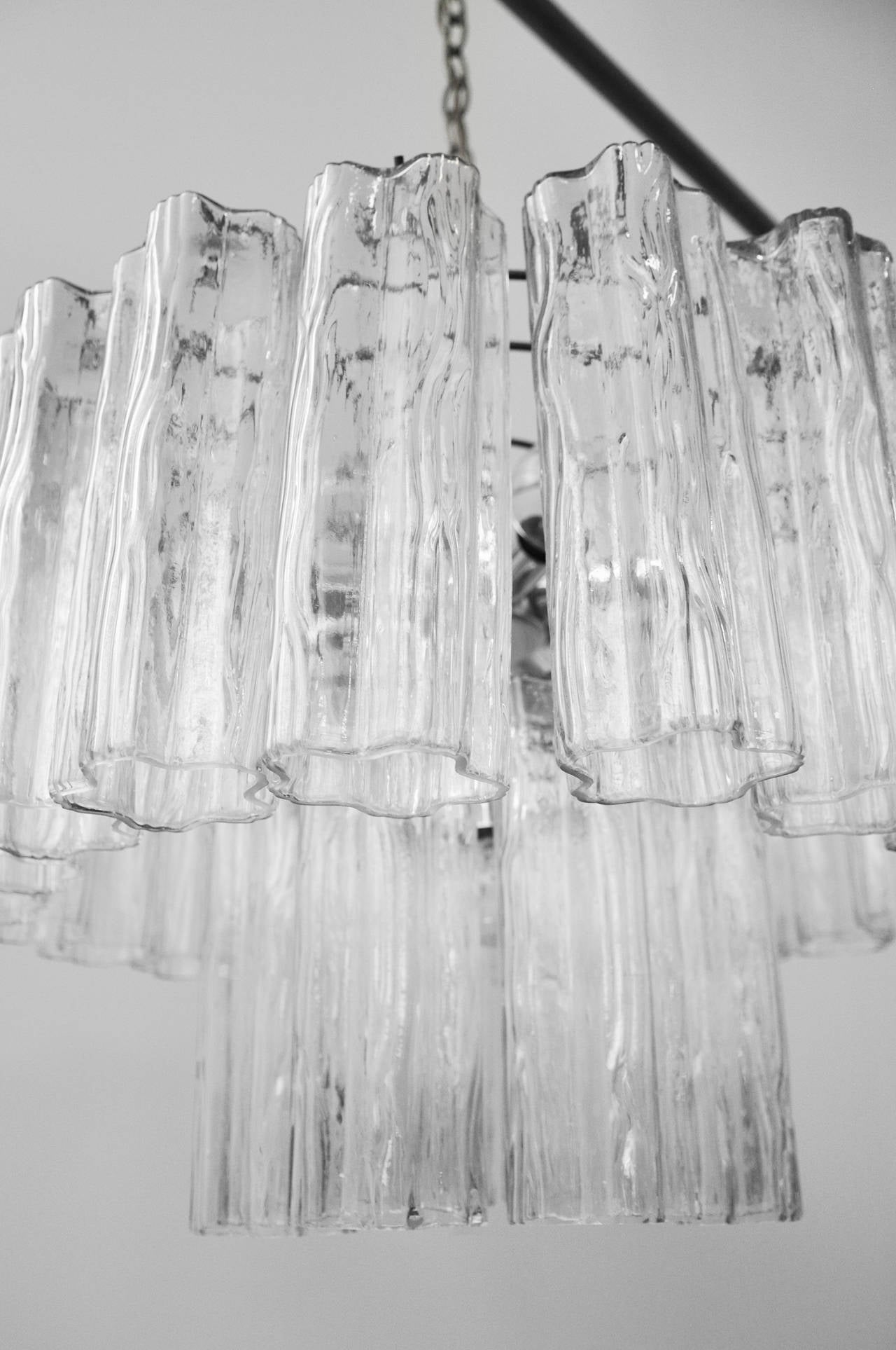 A vintage Murano glass tubular chandelier by Camer. 
Made in Italy in the 1970s. In perfect condition. Glass tubes hang from the chrome electrical structure which has six electrical sockets for standard based bulbs. Wired for USA. Light bulbs are