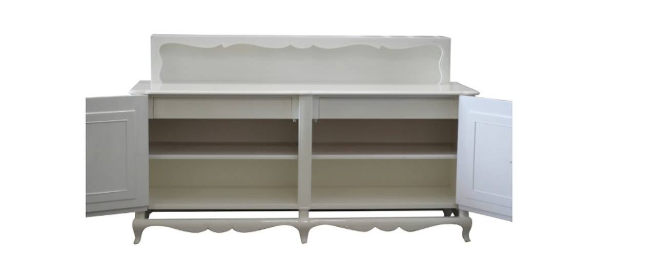 High-style buffet by famed Grosfeld House.  Newly lacquered with beautiful original brass hardware.

