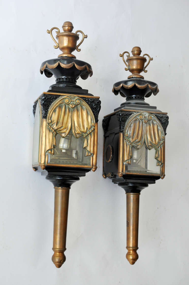 Rare Vintage Coach Lanterns with Exceptional Bronze Drapery Design. 

These highly unusual lanterns would be perfect for the exterior of a beautiful home, coach house or porte cochere or at the entry of a fine home theater (media) room.