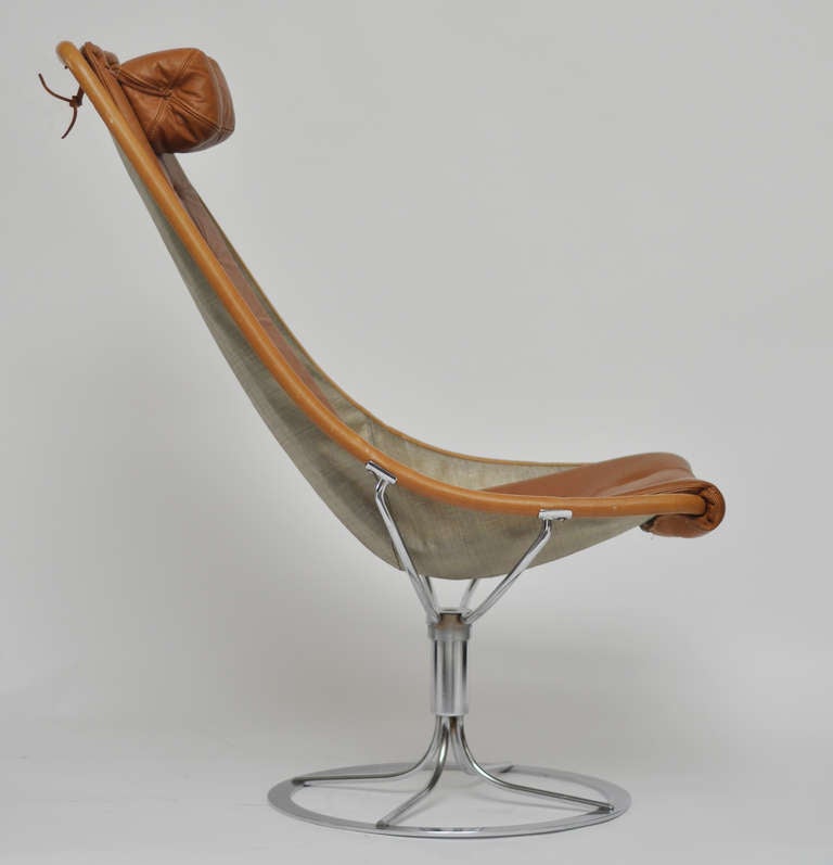 Leather and chrome swivel chair by Swedish Mid Century designer Bruno Mathsson.  Chair is a combination of leather and canvas on a chrome swivel base.  Chair is in excellent vintage condition.

We offer affordable packing and shipping.  Please