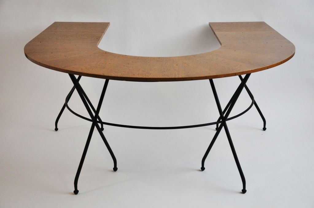 Oak Top on iron base.  Top has two hinged extension leaves that can be up for more surface or down.   Modern version of the Maison Jansen Desk / Table. 
17