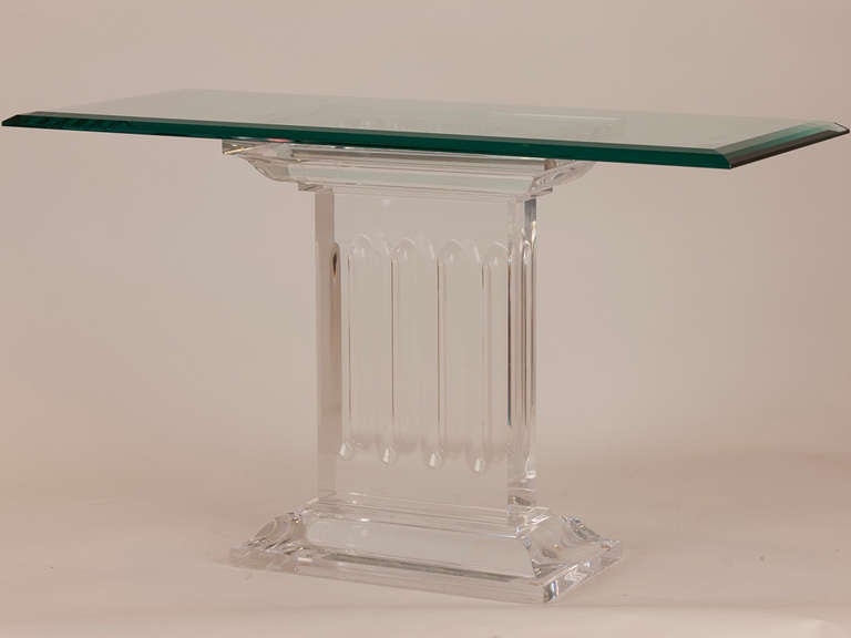 Magnificent pair of French Neoclassic lucite and Glass side tables with column detail.