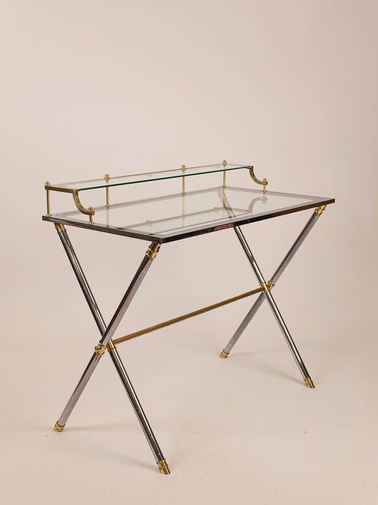 Chic brass, chrome and glass two tier writing desk by Maison Jansen.