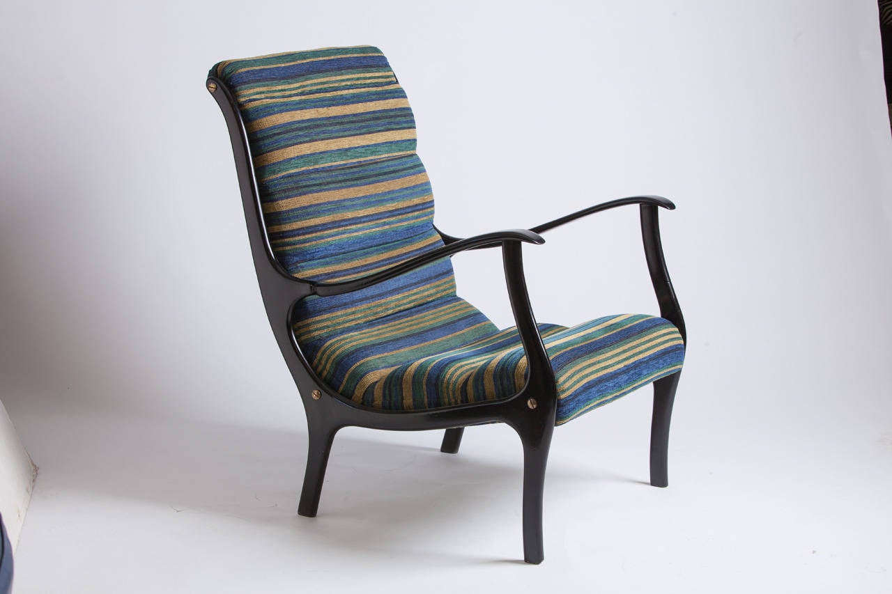 Elegant pair of armchairs by Italian designer Ezio Longhi. Original upholstery in pristine condition.