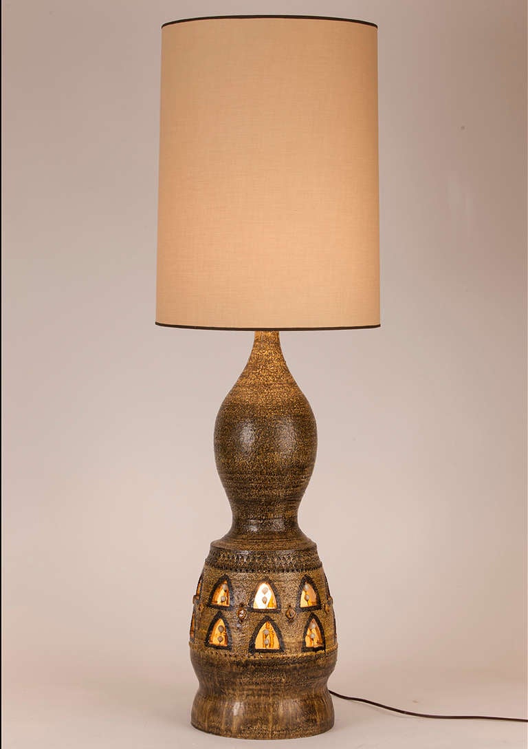 Pristine and rare monumental French ceramic table lamp by Georges Pelletier.  Lamp can be illuminated from within, from the top or both.  Custom silk shade made in Paris.