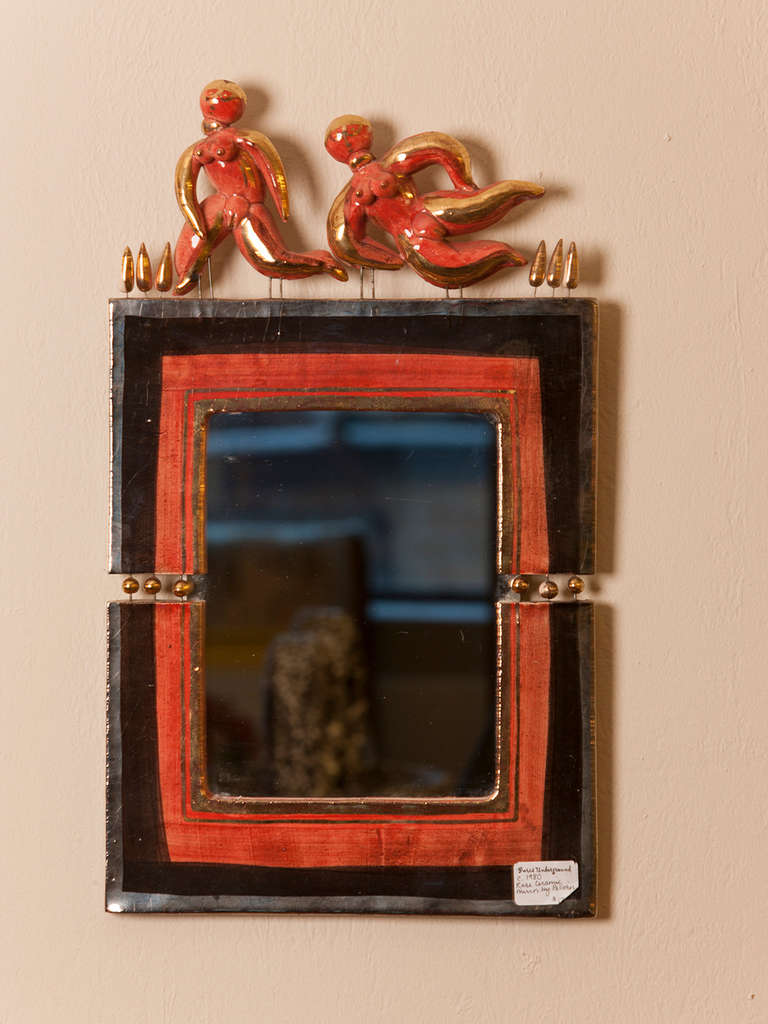 Rare French ceramic wall mirror by Georges Pelletier featuring orange and black glaze and dancing figures.