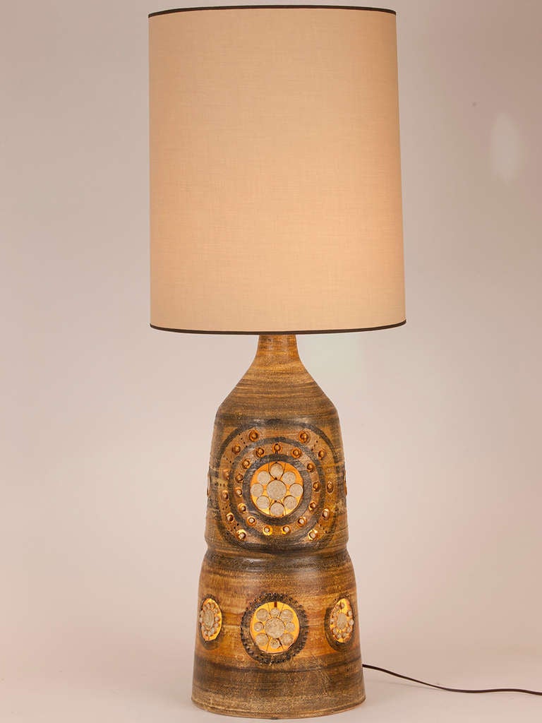 Rare monumental French ceramic lamp by Georges Pelletier.  Lamps base can be illuminated from within, or the top socket or both.  Custom shade made in Paris.