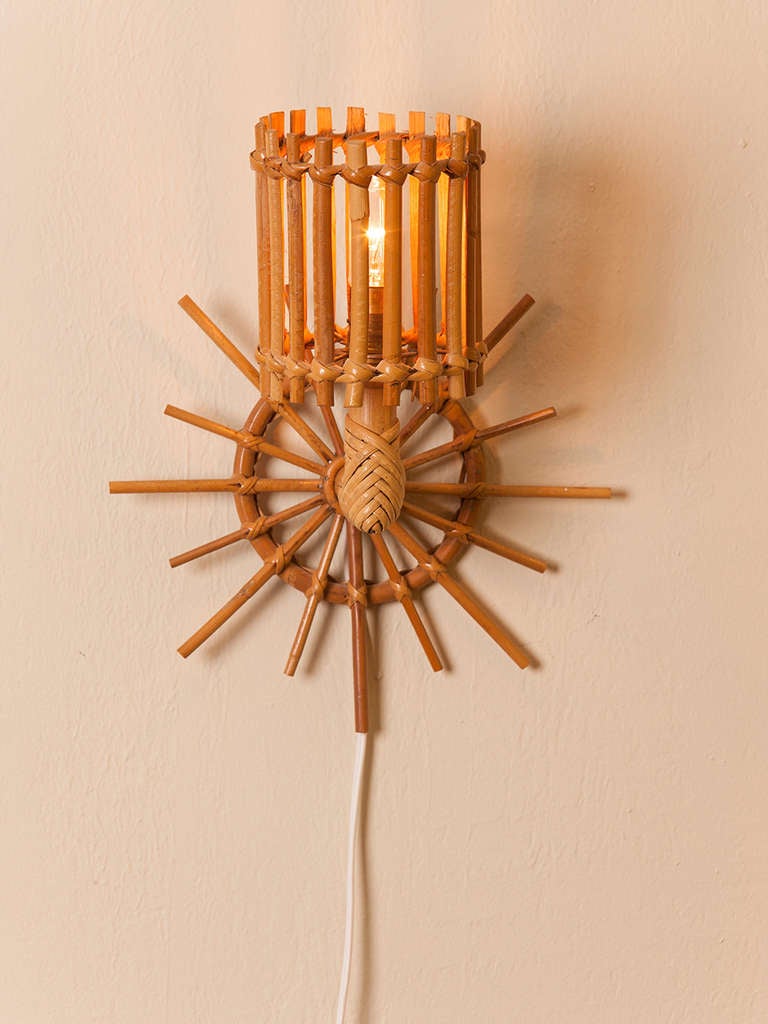 Darling pair of petite French rattan sconces.