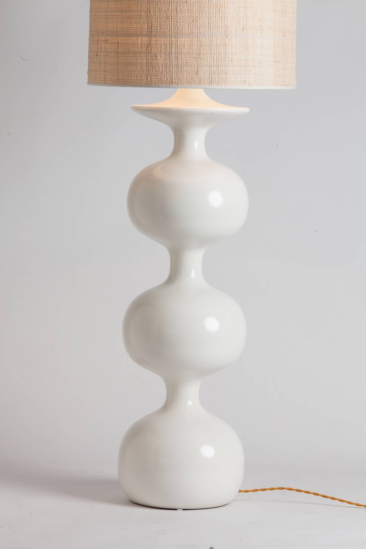 Elegant French lacquered wood table lamp in white. Custom Japanese straw shade made in Paris.