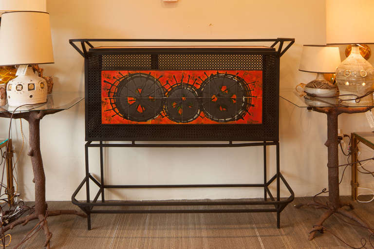 Rare custom indoor/outdoor bar signed Bellarit.  Features hand painted tile and open ironwork.  Storage is divided for glasses and bottles.