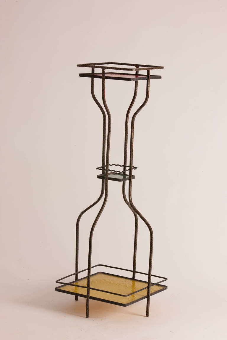 Italian midcentury hammered metal three tier table featuring colored glass tableaus.
