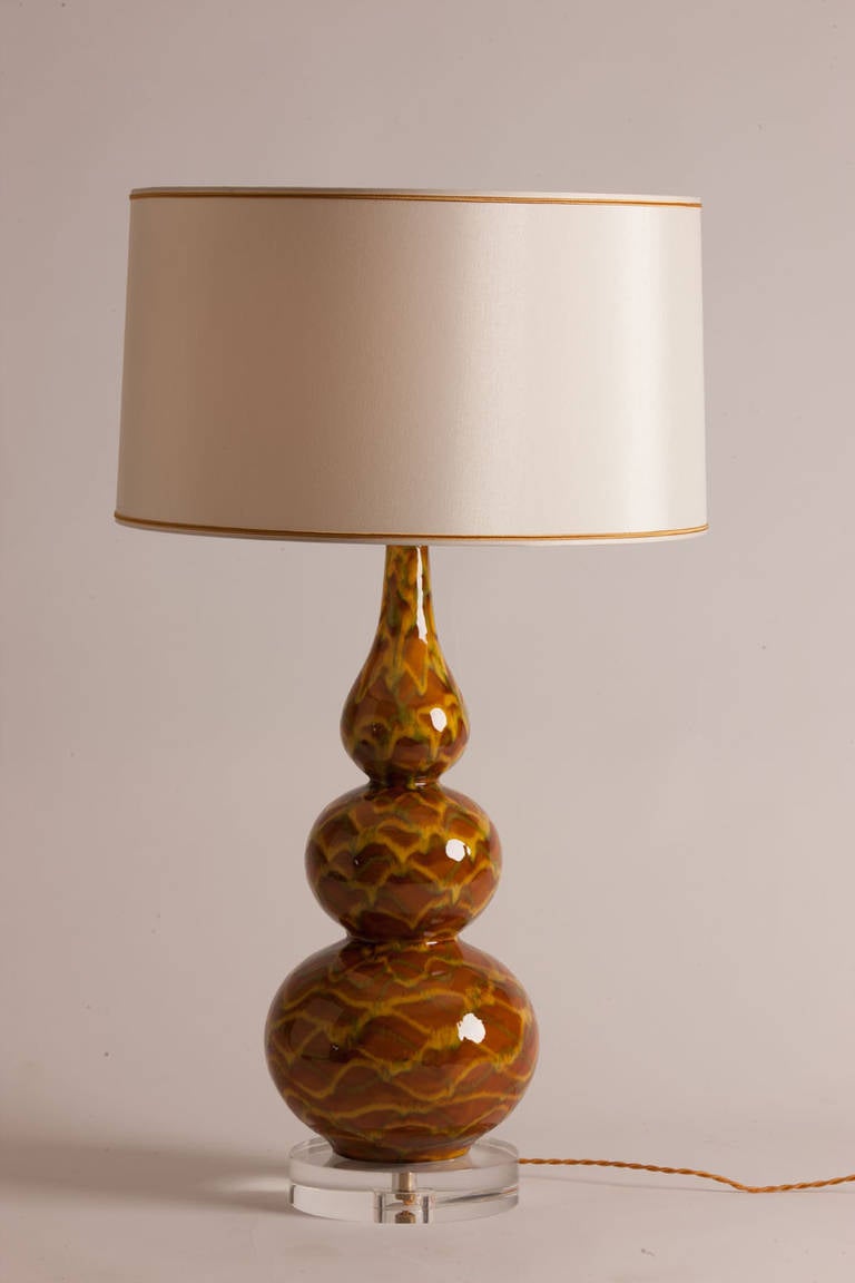 Pair of interesting vintage French ceramic table lamps in umber, yellow and green with custom silk shades made in Paris.