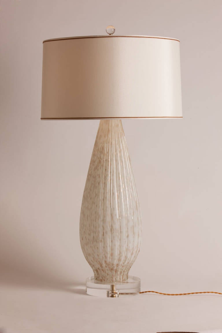Wonderful large scale vintage Murano lamp in cream with copper inclusions.  Rewired and remounted on a custom lucite base, this lamp features a custom silk shade made in Paris.