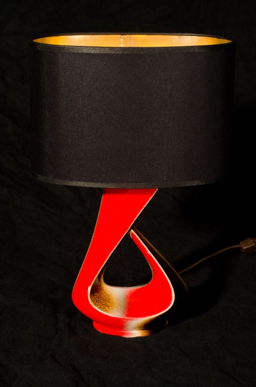 Petite ceramic lamp from Accolay with custom oval shade.  Brilliantly glazed in red, chocolate and white.