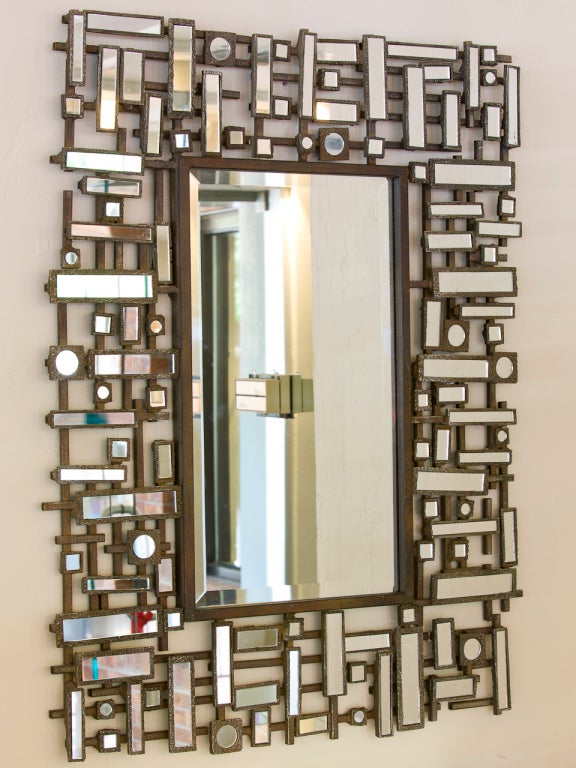 French hand forged metal mirror with custom faceted mirror border.