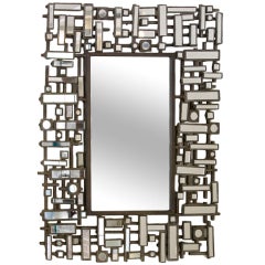 Forged Metal Mirror with Faceted Frame