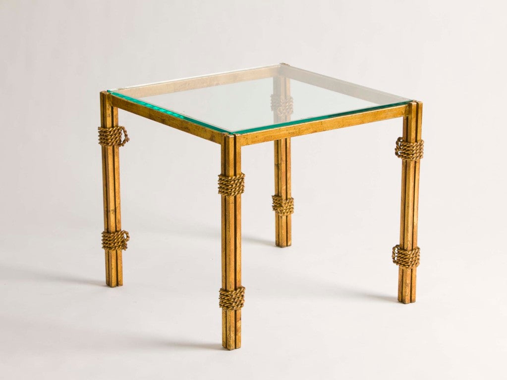 Pair of French gilt metal and glass side tables with rope detail.