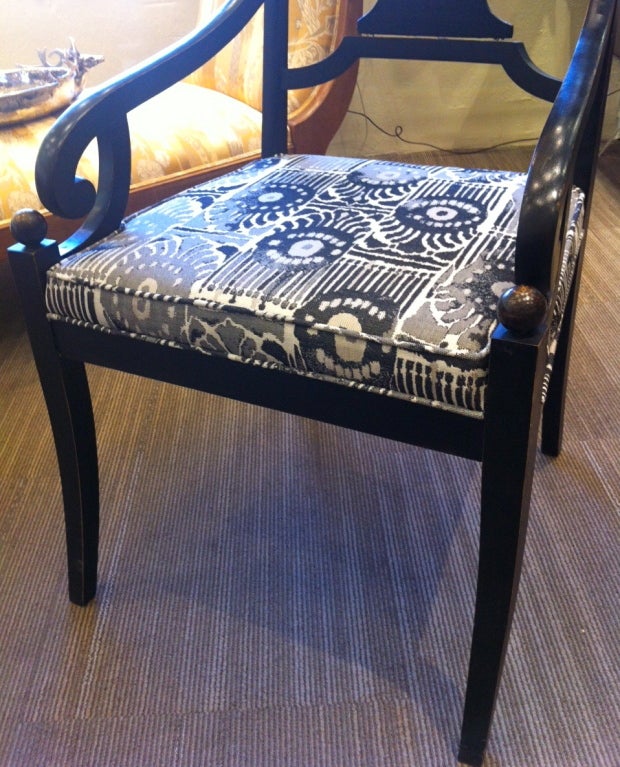 Pair of turn of the century hand-carved Swedish armchairs with curved arms and ball detail. Chairs have been reupholstered in perennials fabric.