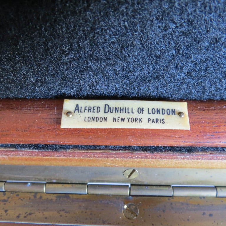A very nice vintage English Art Deco Dunhill cigar humidor. The outside is in a rare Birdseye burl walnut veneer with brass fittings on the corners. The interior is lined with black felt and is tagged “Alfred Dunhill of London” “London, New York,