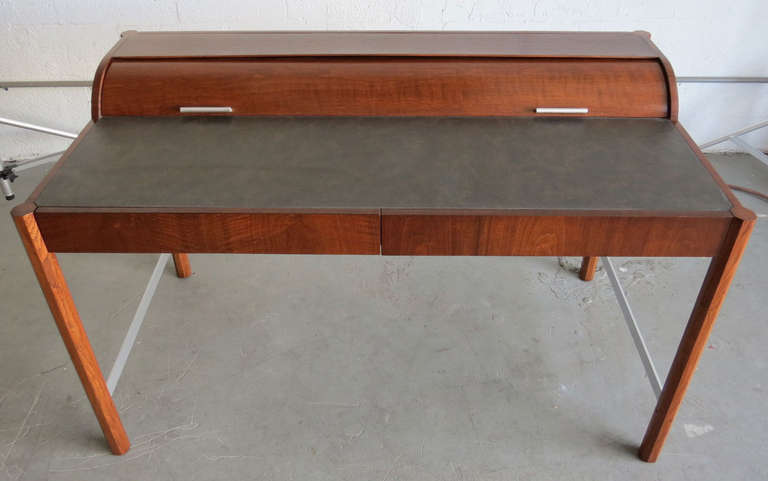 A unique vintage mid century modern roll top desk by the Hekman Furniture Company of Grand Rapids, Michigan. Hekman Furniture was funded in 1922 and become part of the Howard Miller Company in 1983.

The company is still in business but this desk
