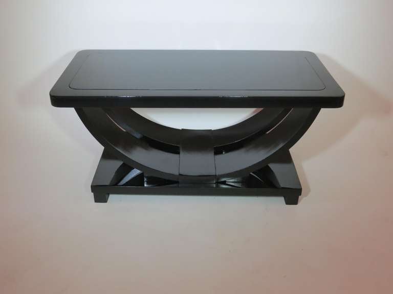 This American art deco black lacquer coffee table was made and retailed by Modernage Furniture Company, New York. Modernage promoted their location at 162 East 33rd St as â??East of the Empire Stateâ?? (Building). The table has been re-lacquered and