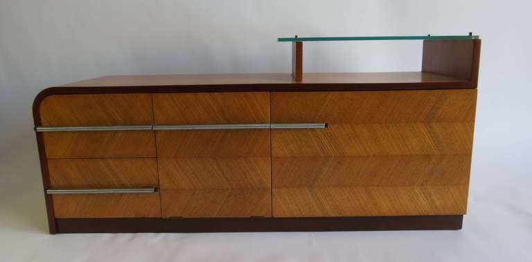 This American art deco vanity chest was designed by Gilbert Rohde (1894 - 1944) for the Herman Miller Furniture Company, Zeeland, Michigan and a similar example was shown at the 1933 Chicago World’s fair in the Design for Living house. The cabinet