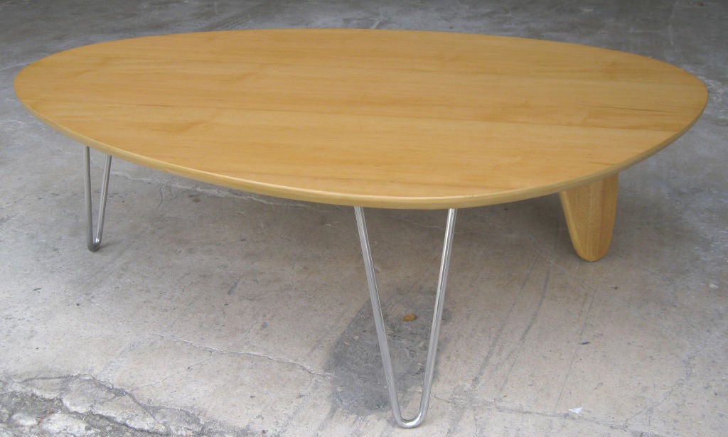 Isamu Noguchi (1904 – 1988) designed this rare and important “Rudder” American art deco coffee table ca. 1944 for the Herman Miller Company in Zeeland, Michigan.  The table, Model IN-52, has a birch veneer top, two “hairpin” aluminum legs and a