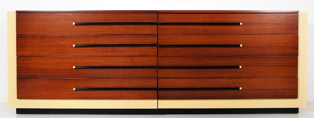 Gilbert Rohde (1886-1944) designed this sleek pair of American art deco chests for the Herman Miller Furniture Company ca 1937. The chests, with face in opposite directions, feature a surround of pale yellow lacquer, drawer fronts in exotic veneers
