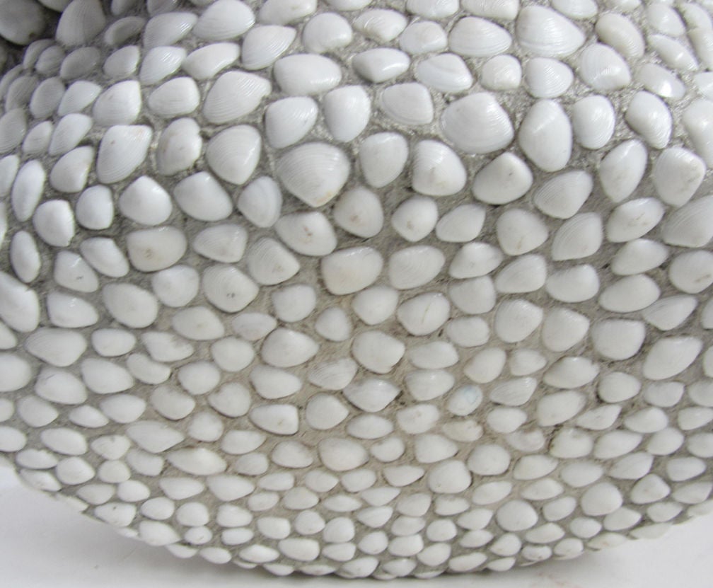 This bowl is by contemporary artist Barton Lidice Benes (1942 -). Typical of Benes late 1970’s work, the bowl is composed of hundreds of sea shells in a matrix of his own making. Known as a master of “found” elements in his work, the shells are