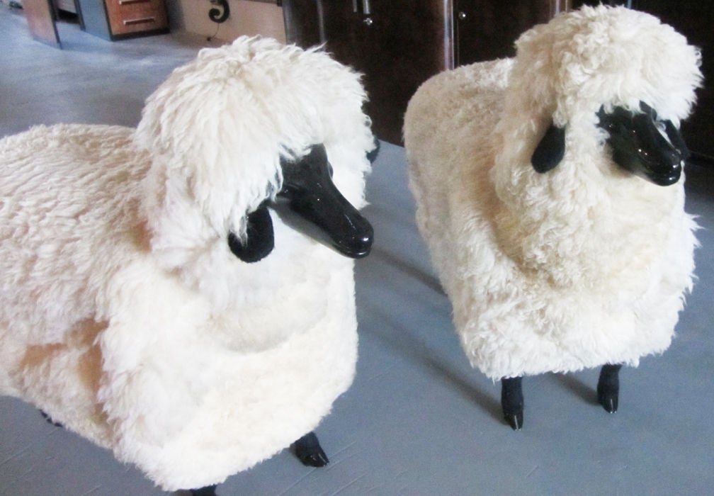 This pair of fluffy sheep were made in the 1970’s after models made by Francois-Xavier Lalanne (1927 -2008). Constructed of ebonized wood and real sheep's wool, the animals' function is surrealistic furniture as they can be used as seating. The
