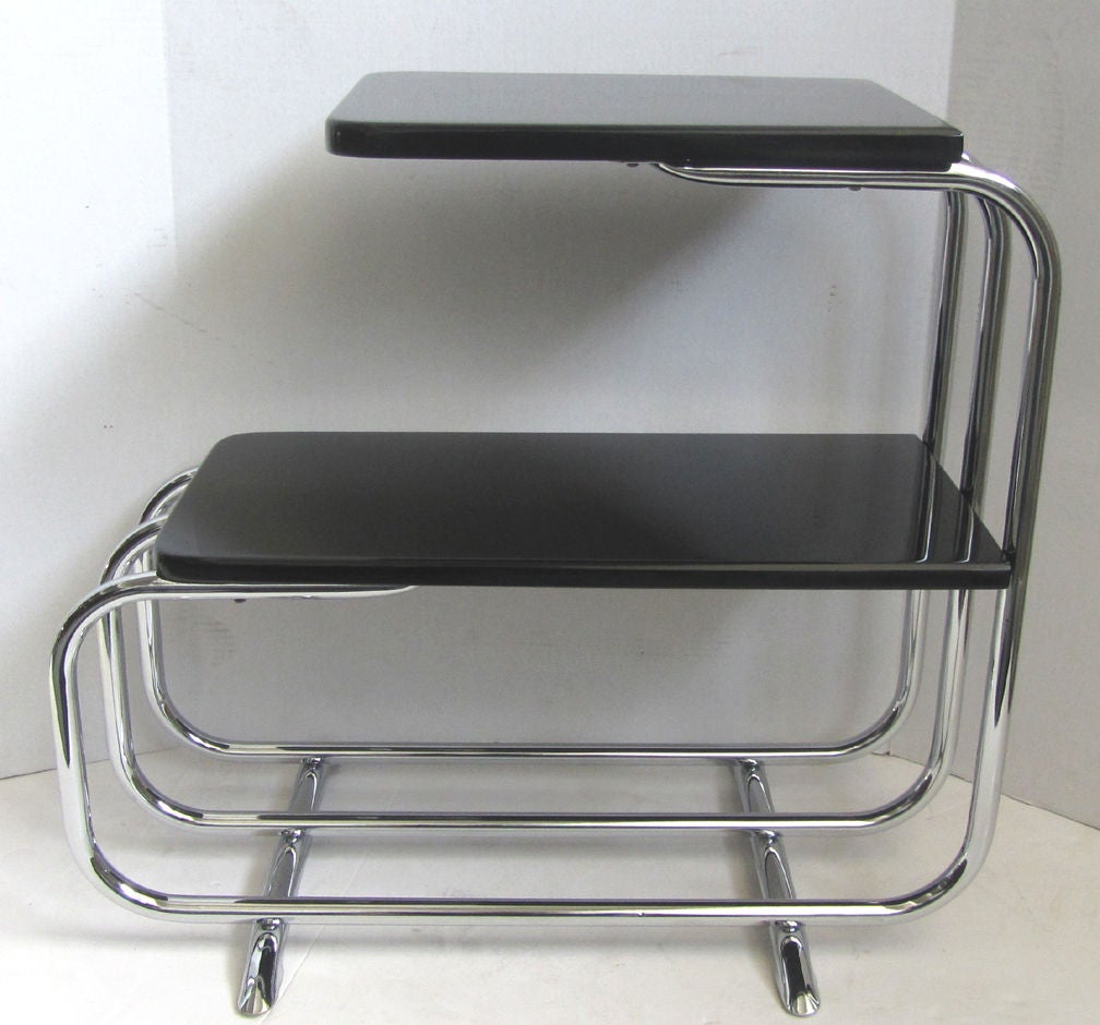 This streamline American art deco sofa side table was designed by Alfons Bach (1904 - 1999) for the Lloyd Manufacturing Company of Menomonee, Michigan. Part of their Chromium furniture line, the table is number T-57-A and is pictured in their 1937