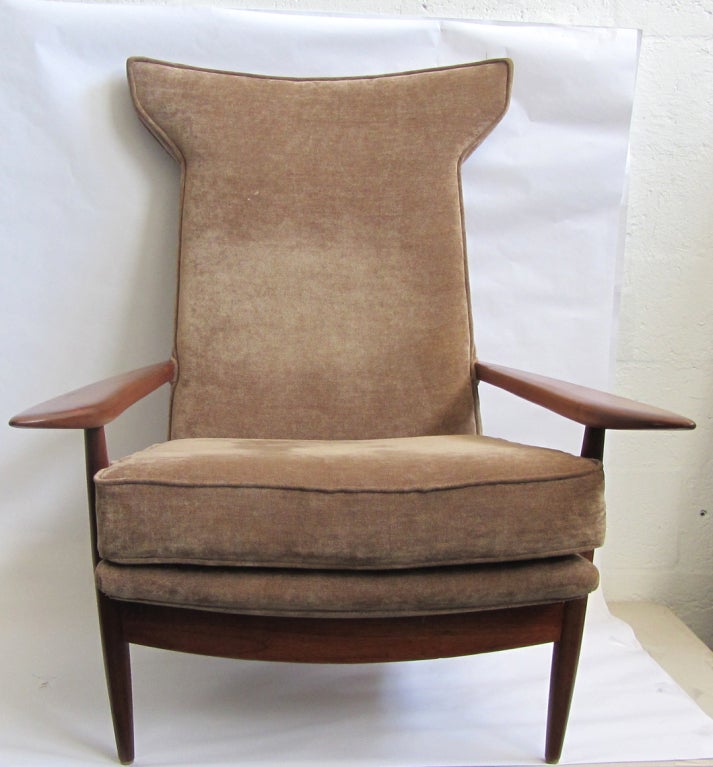 George Nakashima  (1905 -1990) designed this iconic  mid century modern hi-back lounge chair ca 1955 for his ORIGINS line, produced by the Widdicomb Furniture Company, Grand Rapids, Michigan. The chair, with solid walnut construction, is known for